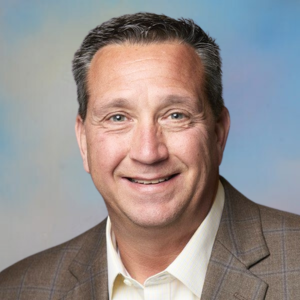 A professional headshot of Kenny Woodard, a North Carolina State Ports Authority Board Member.